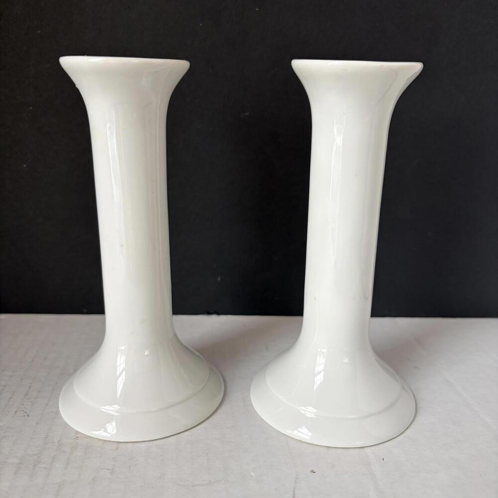 A pair of vintage Ikea white ceramic modern design candlestick holders.